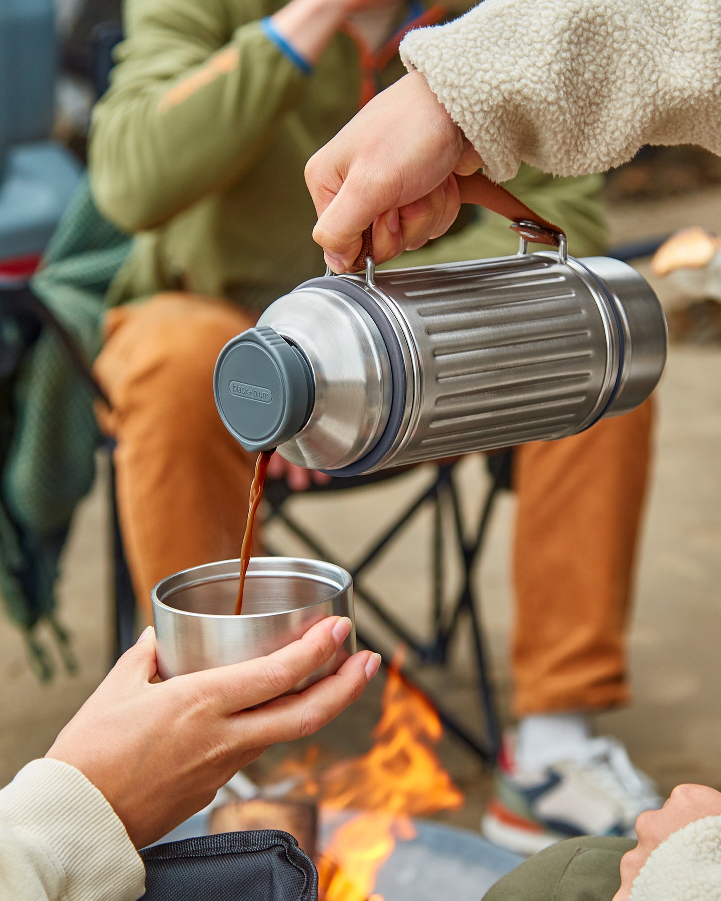 Explorer Flask Pouring Into Cups
