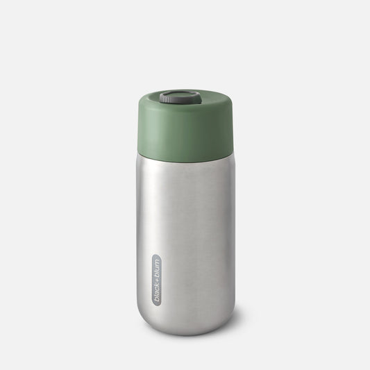 A stainless steel insulated travel cup with a green lid.