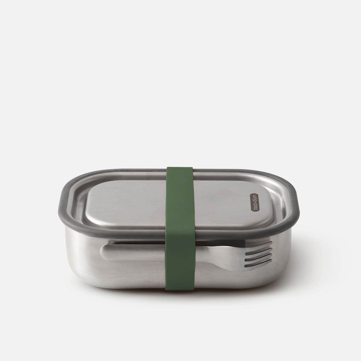 A silver stainless steel lunch box with a green strap securing the lid.