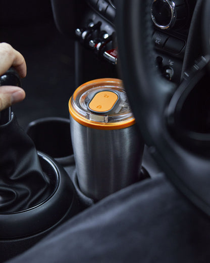 The travel tumbler fits in car cup holders